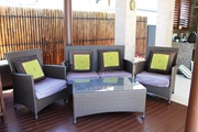 RATTAN OUTDOOR LOUNGE SETTING WITH GLASS TOP COFFEE TABLE