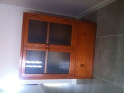 Timber cupboard with two glass doors. $50.00
